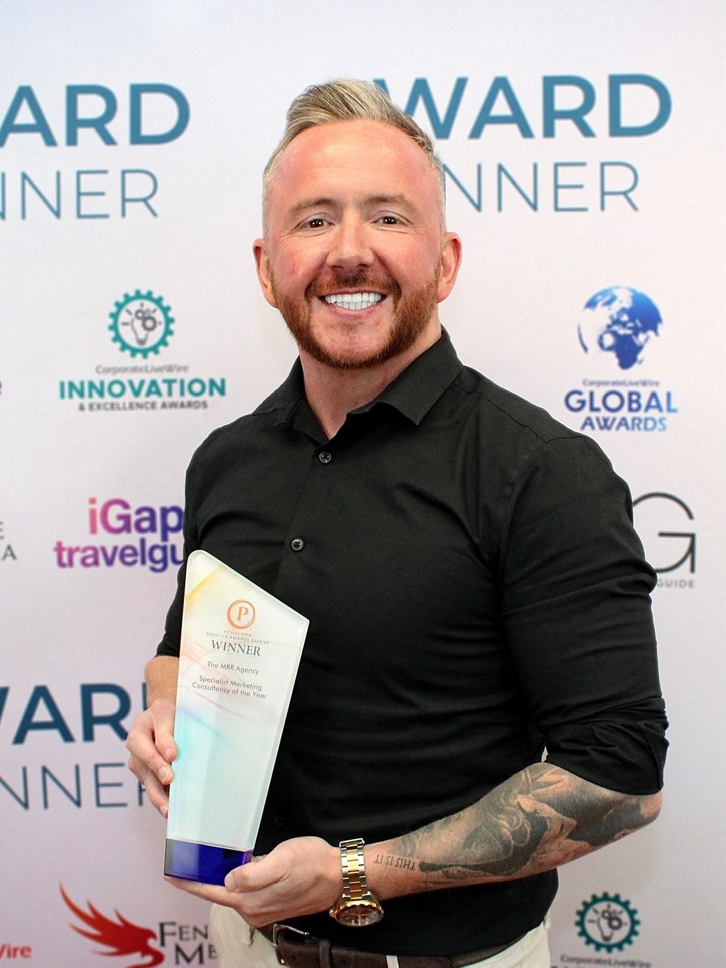 Chris Bradley holding the Specialist Marketing Consultancy of the Year award
